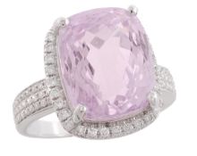 A kunzite and diamond ring, the rectangular cushion cut kunzite, estimated to weigh 8.23 carats, in