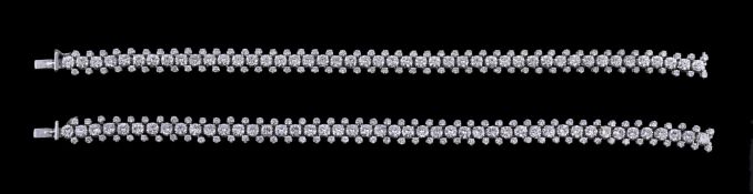 A pair of diamond line bracelets, the articulated bracelet set with fourty six brilliant cut