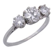 A diamond three stone ring, the central diamond weighing 1.02 carats, claw set with a brilliant cut