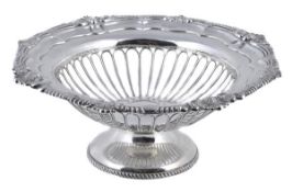 A silver shaped circular pedestal fruit basket by Harrison Brothers & Howson, Sheffield 1929, with