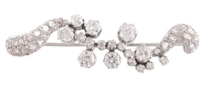 A diamond scroll brooch, the bar brooch set throughout with old brilliant cut, old cut and rose cut