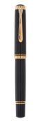 Pelikan, M1000, a black lacquer fountain pen, the black lacquer cap and barrel with gilt trim, the