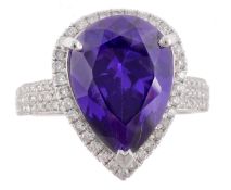 An amethyst and diamond ring, the pear shaped amethyst, estimated to weigh  9.9 carats, in a claw