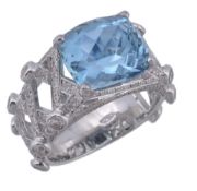 An aquamarine and diamond ring, the rectangular cushion fancy cut aquamarine, estimated to weigh 5.