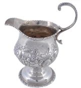 An early George III silver baluster cream jug by Samuel Meriton, London 1764, with a cable-capped