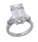 A diamond single stone ring, the baguette cut diamond, weighing 6.05 carats, claw set above tapered