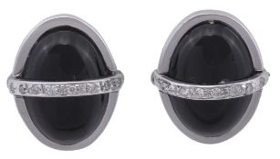 A pair of diamond and onyx cufflinks, the oval cabochon onyx panels with a central bar with