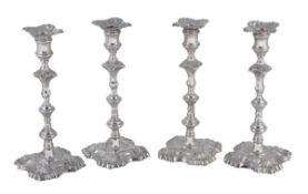 A set of four George III Scottish cast silver candlesticks by Gillsand & Ker, Edinburgh 1771, the