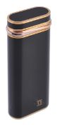 Cartier, a black lacquer lighter,  no E66281, the oblong shaped lighter with trinity ring detail,