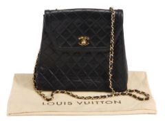 Chanel, a black quilted leather shoulder/clutch bag, of tapering rectangular outline with gilt CC