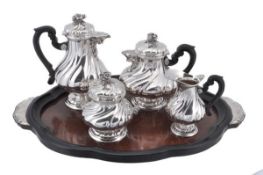 An Italian silver coloured four piece tea and coffee service on a mounted wooden tray, maker`s mark