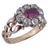 An early Victorian ruby and diamond cluster ring, circa 1840, the rectangular cut ruby within a