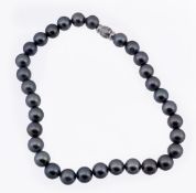 A South Sea grey cultured pearl necklace, the thirty two 13.5mm grey South Sea cultured pearls to a