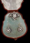 A Victorian diamond brooch and cluster ear pendents, circa 1860, the floral foliate brooch with a