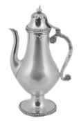 An Ottoman silver baluster small coffee pot, Tughra and sah marks, circa 1900, with an urn finial