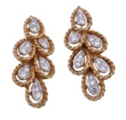 A pair of diamond earrings, the brilliant cut diamonds set in pear shaped panels each with a