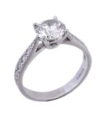 A platinum and diamond ring, the brilliant cut diamond, stated to weigh 1.23 carats, in a four claw