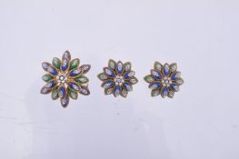 A pair of enamel and diamond ear clips and brooch, circa 1970, the flower head ear clips with a