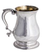 A late George II silver baluster mug, maker`s mark mis-struck possibly ÔW.C` (perhaps William