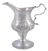 A George III silver ogee baluster cream jug by Thomas Shepherd, London 1779, with a leaf-capped