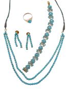 A turquoise necklace, the necklace with two rows of round cabochon turquoise in four claw gold