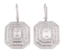 A pair of diamond ear pendents, each set with an octagonal panel, centrally set with a rectangular
