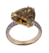 A chrysoberyl and diamond ring, the triangular fancy cut chrysoberyl, stated to weigh 9.80 carats,