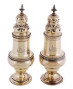 A pair of Edwardian silver gilt sugar casters by The Goldsmiths & Silversmiths Co. Ltd, London