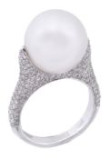 A South Sea cultured pearl and diamond ring, the 14.2mm South Sea cultured pearl set amongst pave
