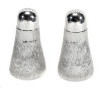 A pair of silver pepper casters by Gerald Benney, London 1985, each stamped Gerald Benney London,