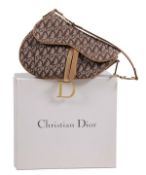Christian Dior, a brown canvas saddle bag, with Christian Dior monogram throughout and brown