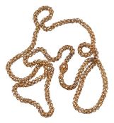 A Regency gold long chain, circa 1820, the textured fancy links with applied circular disc detail,