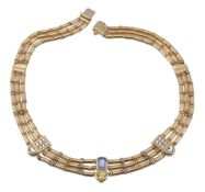 A gem set gold collar necklace by Manfredi for Mappin and Webb, the collar composed of three rows