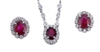 A pair of ruby and diamond cluster ear studs and pendant, the ear studs with oval cut rubies within