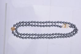 A hematite bead necklace by Tiffany & Co., the ninety uniform hematite beads on a knotted string,