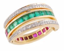 An emerald, ruby and diamond swivel Day and Night eternity ring, half set with square cut rubies