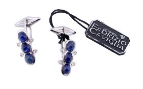 A pair of sapphire and diamond cufflinks, the shaped panels set with a trio of oval cabochon