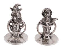 A pair of silver novelty Punch and Judy menu holders by Horace Woodward & Co. Ltd, London 1911 and
