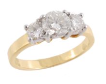 A three stone diamond ring, the graduated brilliant cut diamonds, approximately 1.25 carats total,