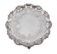 A George II silver shaped circular salver by William Peaston, London 1752, with a shell and scroll