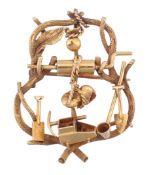 A gold prospector`s brooch, circa 1860, with various gold digging paraphernalia, including a