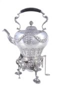 An Edwardian silver ogee tea kettle on stand by C. S. Harris & Sons Ltd, London 1906, with a black