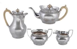 A silver and ivory baluster four piece tea service by Mappin & Webb, London 1924, the tea and