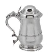 An early George III silver baluster tankard by James Tookey, London 1761, the ogee domed cover with