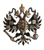 A Russian gold and coloured enamel Imperial double-headed eagle badge, unmarked, circa 1900, with