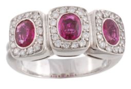 A pink sapphire and diamond ring, the three oval shaped pink sapphires with a surround of brilliant