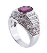 A ruby and diamond bombe ring, the central oval cut ruby in a collet setting, between square cut