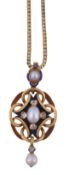 A Victorian blue enamel, diamond and pearl pendant, circa 1860, the central oval shaped pearl with