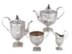 A Victorian silver pedestal four piece tea and coffee service by Sibray, Hall & Co. (Frederick