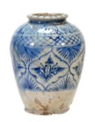A Middle Eastern Pottery Jar of tapered ovoid form with slightly splayed foot and a rolled neck,